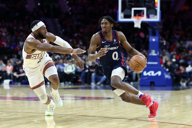 PHILADELPHIA, PENNSYLVANIA - NOVEMBER 04: Tyrese Maxey #0 of the Philadelphia 76ers drives past Josh Okogie #2 of the Phoenix Suns during the second quarter at the Wells Fargo Center on November 04, 2023 in Philadelphia, Pennsylvania. NOTE TO USER: User expressly acknowledges and agrees that, by downloading and or using this photograph, User is consenting to the terms and conditions of the Getty Images License Agreement. (Photo by Tim Nwachukwu/Getty Images)