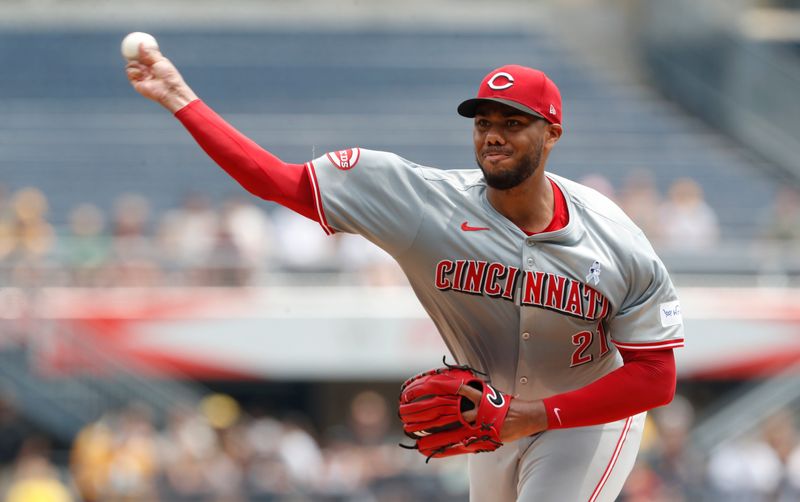 Jun 19, 2024; Pittsburgh, Pennsylvania, USA;  Cincinnati Reds starting pitcher Hunter Greene (21) delivers a pitch against the Pittsburgh Pirates during the first inning at PNC Park. Mandatory Credit: Charles LeClaire-USA TODAY Sports