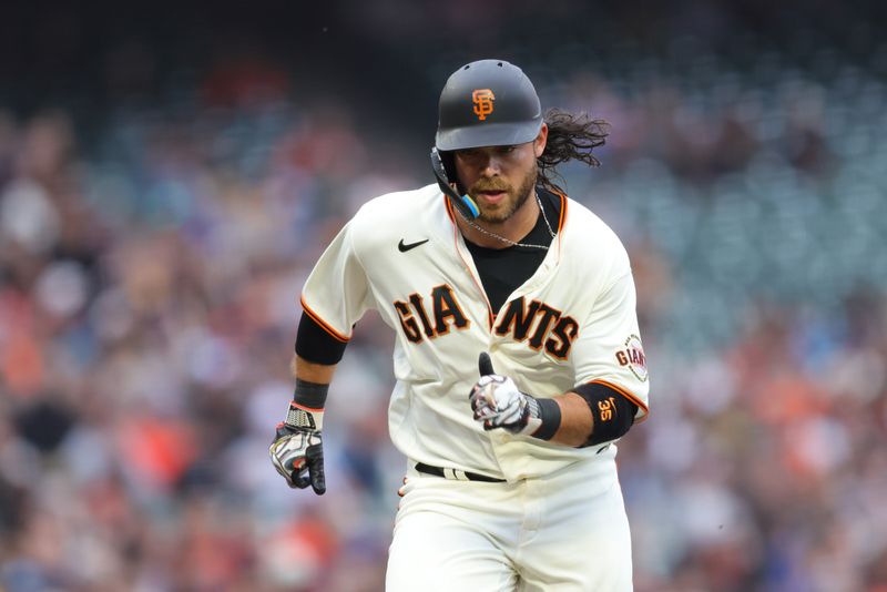 Jul 5, 2023; San Francisco, California, USA; San Francisco Giants shortstop Brandon Crawford (35) scores on a sac fly by first baseman LaMonte Wade Jr. (not pictured) during the third inning against the Seattle Mariners at Oracle Park. Mandatory Credit: Sergio Estrada-USA TODAY Sports