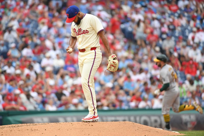 Jul 14, 2024; Philadelphia, Pennsylvania, USA; Philadelphia Phillies pitcher Seranthony Domínguez (58) reacts after allowing home run to Oakland Athletics outfielder Seth Brown (15) during the sixth inning at Citizens Bank Park. Mandatory Credit: Eric Hartline-USA TODAY Sports