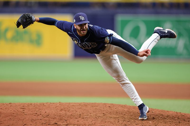 Sep 9, 2023; St. Petersburg, Florida, USA;  Tampa Bay Rays relief pitcher Colin Poche (38) throws a pitch against the Seattle Mariners in the ninth inning at Tropicana Field. Mandatory Credit: Nathan Ray Seebeck-USA TODAY Sports