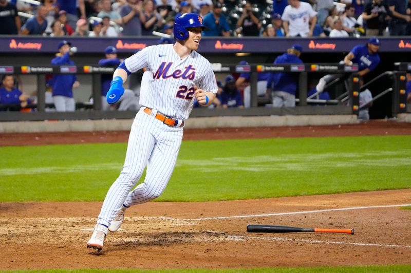 Jul 16, 2023; New York City, New York, USA; New York Mets third basaman Brett Baty (22) scores the game winning run on New York Mets second baseman Luis Guillorme (not pictured) game winning hit against the Los Angeles Dodgers during the tenth inning at Citi Field. Mandatory Credit: Gregory Fisher-USA TODAY Sports