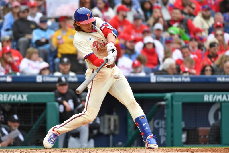 Apr 21, 2024; Philadelphia, Pennsylvania, USA; Philadelphia Phillies third base Alec Bohm (28) hits an RBI double against the Chicago White Sox during the fourth inning at Citizens Bank Park. Mandatory Credit: Eric Hartline-USA TODAY Sports