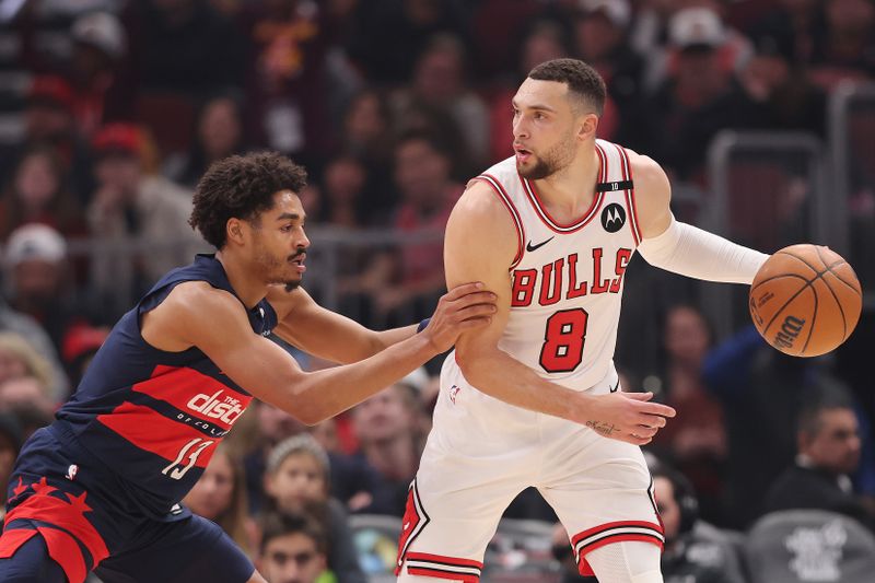 CHICAGO, ILLINOIS - JANUARY 10: Zach LaVine #8 of the Chicago Bulls is defended by Jordan Poole #13 of the Washington Wizards during the first half at the United Center on January 10, 2025 in Chicago, Illinois. NOTE TO USER: User expressly acknowledges and agrees that, by downloading and or using this photograph, User is consenting to the terms and conditions of the Getty Images License Agreement.  (Photo by Michael Reaves/Getty Images)