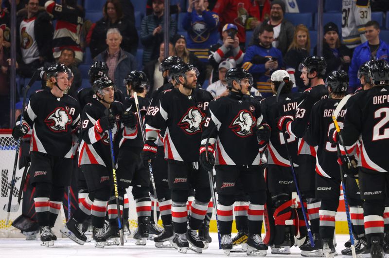 Jan 11, 2024; Buffalo, New York, USA;  The Buffalo Sabres celebrate a win over the Ottawa Senators at KeyBank Center. Mandatory Credit: Timothy T. Ludwig-USA TODAY Sports