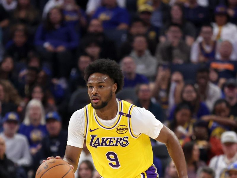 SAN FRANCISCO, CALIFORNIA - OCTOBER 18: Bronny James #9 of the Los Angeles Lakers dribbles the ball up court during the first half of their preseason game against the Golden State Warriors at Chase Center on October 18, 2024 in San Francisco, California.  NOTE TO USER: User expressly acknowledges and agrees that, by downloading and/or using this photograph, user is consenting to the terms and conditions of the Getty Images License Agreement.  (Photo by Ezra Shaw/Getty Images)