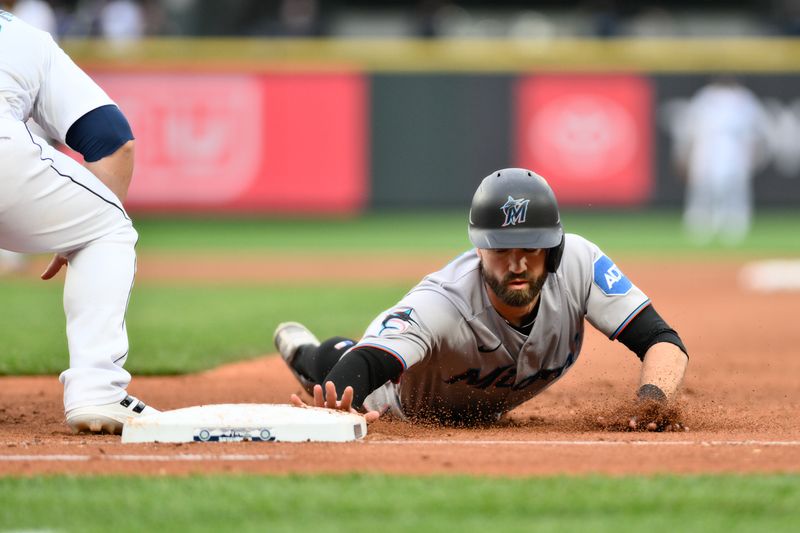 Jun 14, 2023; Seattle, Washington, USA; Miami Marlins shortstop Jon Berti (5) returns to first base during the fifth inning against the Seattle Mariners at T-Mobile Park. Mandatory Credit: Steven Bisig-USA TODAY Sports