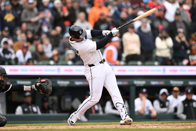 Apr 6, 2025; Detroit, Michigan, USA;  Detroit Tigers first baseman Spencer Torkelson (20) hits a game-winning walk off double against the Chicago White Sox in the ninth inning at Comerica Park. Mandatory Credit: Lon Horwedel-Imagn Images