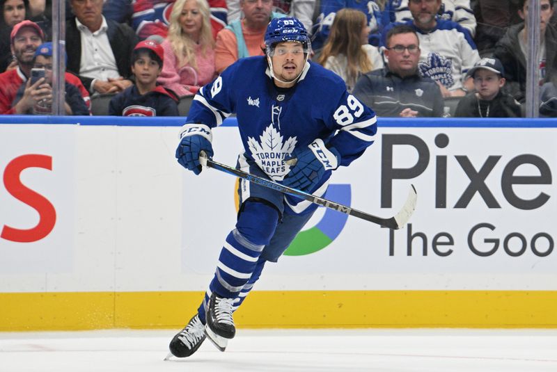 Sep 26, 2024; Toronto, Ontario, CAN;  Toronto Maple Leafs forward Nick Robertson (89) pursues the play against the Montreal Canadiens in the third period at Scotiabank Arena. Mandatory Credit: Dan Hamilton-Imagn Images