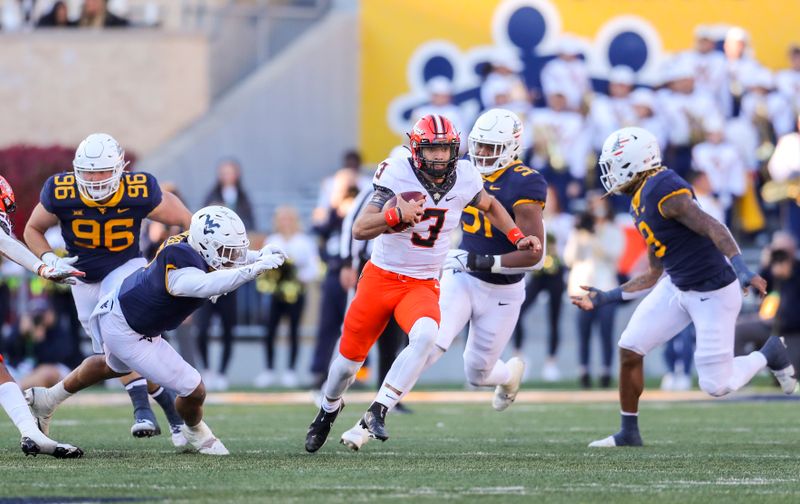 Nov 6, 2021; Morgantown, West Virginia, USA; Oklahoma State Cowboys quarterback Spencer Sanders (3) runs the ball during the second quarter against the West Virginia Mountaineers at Mountaineer Field at Milan Puskar Stadium. Mandatory Credit: Ben Queen-USA TODAY Sports