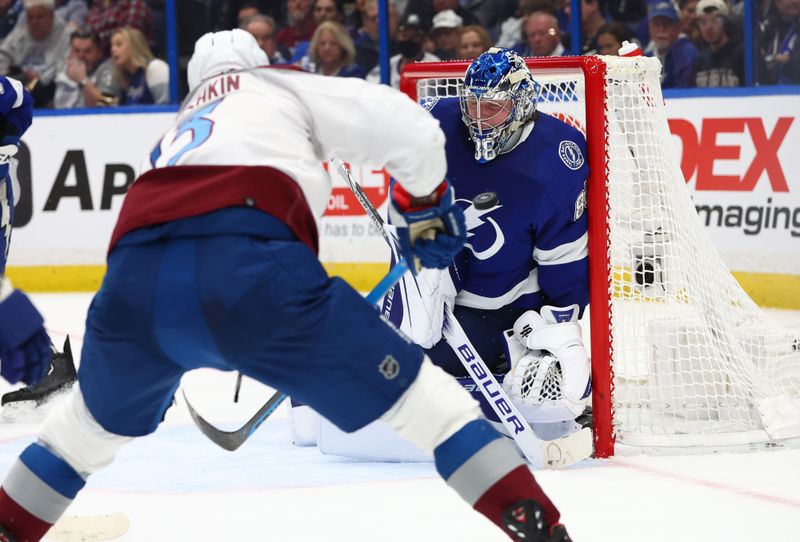 Feb 9, 2023; Tampa, Florida, USA;Tampa Bay Lightning goaltender Andrei Vasilevskiy (88) makes a save from Colorado Avalanche right wing Valeri Nichushkin (13)  during the second period at Amalie Arena. Mandatory Credit: Kim Klement-USA TODAY Sports