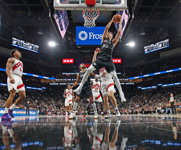 SAN ANTONIO, TX - NOVEMBER 5:  Zach Collins #23 of the San Antonio Spurs grabs a rebound over the Toronto Raptors at Frost Bank Center on November  5, 2023 in San Antonio, Texas. NOTE TO USER: User expressly acknowledges and agrees that, by downloading and or using this photograph, User is consenting to terms and conditions of the Getty Images License Agreement. (Photo by Ronald Cortes/Getty Images)