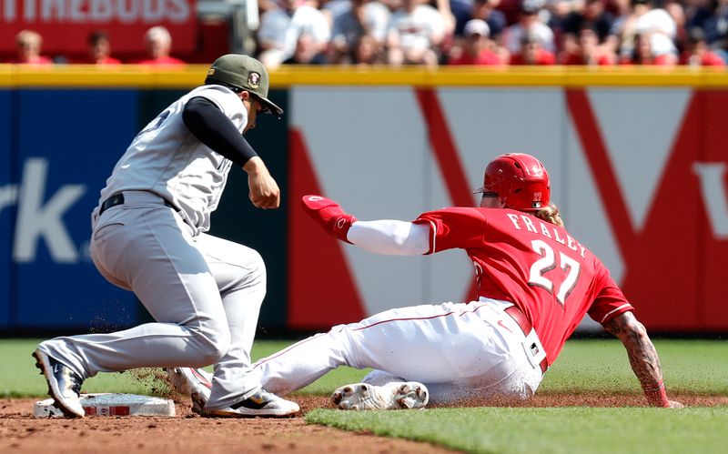 May 20, 2023; Cincinnati, Ohio, USA; Cincinnati Reds left fielder Jake Fraley (27) is picked off stealing second against New York Yankees second baseman Gleyber Torres (25) during the first inning at Great American Ball Park. Mandatory Credit: David Kohl-USA TODAY Sports