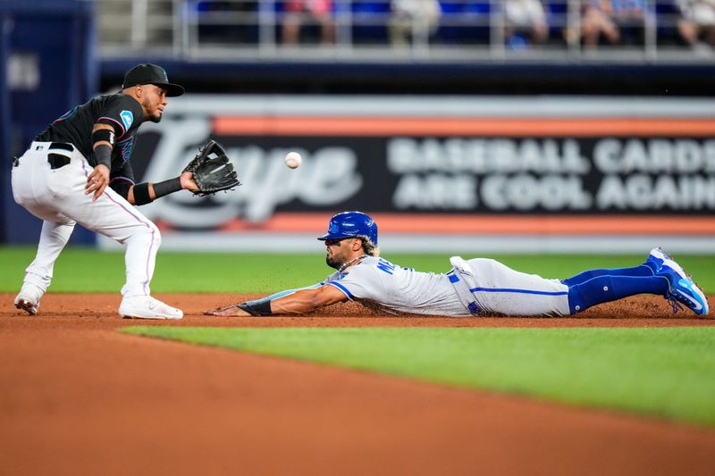 Jun 7, 2023; Miami, Florida, USA; Miami Marlins second baseman Luis Arraez (3) tags out Kansas City Royals right fielder MJ Melendez (1) during the fourth inning at loanDepot Park. Mandatory Credit: Rich Storry-USA TODAY Sports