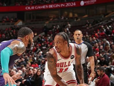 CHICAGO, IL - DECEMBER 6: DeMar DeRozan #11 of the Chicago Bulls handles the ball during the game against the Charlotte Hornets on December 6, 2023 at the United Center in Chicago, Illinois. NOTE TO USER: User expressly acknowledges and agrees that, by downloading and or using this Photograph, user is consenting to the terms and conditions of the Getty Images License Agreement. Mandatory Copyright Notice: Copyright 2023 NBAE (Photo by Gary Dineen/NBAE via Getty Images).