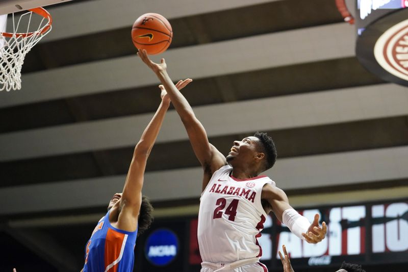 Feb 8, 2023; Tuscaloosa, Alabama, USA; Alabama Crimson Tide forward Brandon Miller (24) grabs a rebound against Florida Gators guard Will Richard (5) during the first half at Coleman Coliseum. Mandatory Credit: Marvin Gentry-USA TODAY Sports