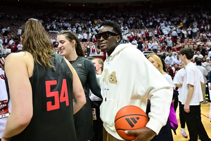 Feb 22, 2024; Bloomington, Indiana, USA; Former Indiana Pacer Victor Oladipo shares a moment with the Indiana Hoosiers after the game against the Iowa Hawkeyes at Simon Skjodt Assembly Hall. Mandatory Credit: Marc Lebryk-USA TODAY Sports