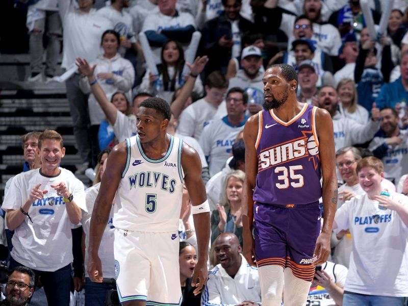 MINNEAPOLIS, MN -  APRIL 20: Anthony Edwards #5 of the Minnesota Timberwolves and Kevin Durant #35 of the Phoenix Suns look on during Round One Game One of the 2024 NBA Playoffs on April 20, 2024 at Target Center in Minneapolis, Minnesota. NOTE TO USER: User expressly acknowledges and agrees that, by downloading and or using this Photograph, user is consenting to the terms and conditions of the Getty Images License Agreement. Mandatory Copyright Notice: Copyright 2024 NBAE (Photo by Jordan Johnson/NBAE via Getty Images)