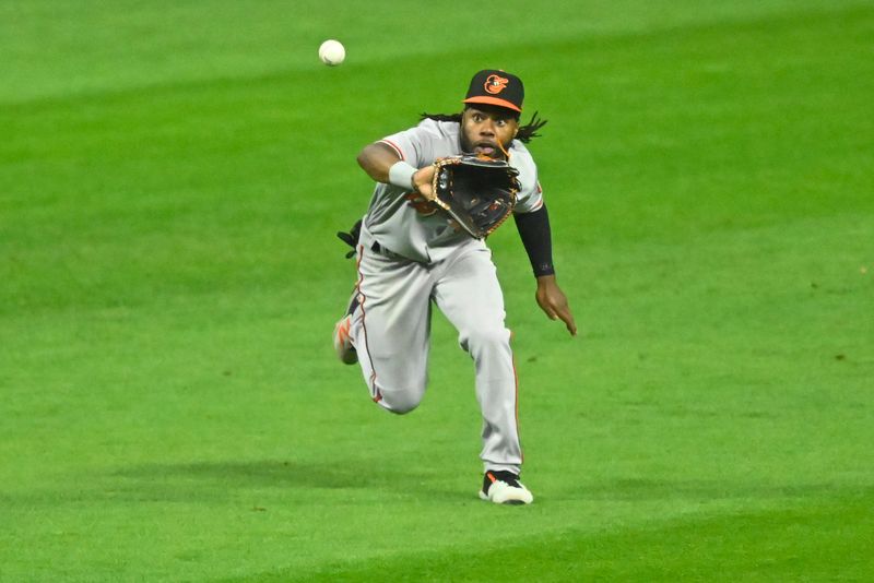 Sep 21, 2023; Cleveland, Ohio, USA; Baltimore Orioles center fielder Cedric Mullins (31) makes a catch in the seventh inning against the Cleveland Guardians at Progressive Field. Mandatory Credit: David Richard-USA TODAY Sports