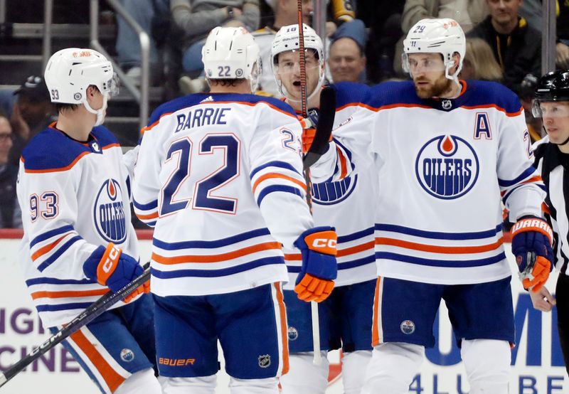 Feb 23, 2023; Pittsburgh, Pennsylvania, USA;  Edmonton Oilers center Leon Draisaitl (29) celebrates his goal with teammates against the Pittsburgh Penguins during the first period at PPG Paints Arena. Edmonton won 7-2. Mandatory Credit: Charles LeClaire-USA TODAY Sports