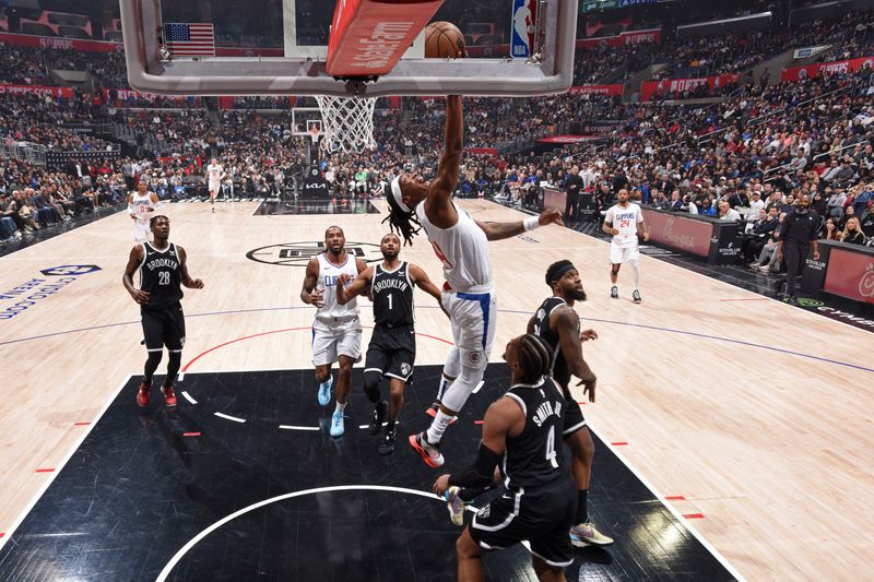 LOS ANGELES, CA - JANUARY 21: Terance Mann #14 of the LA Clippers drives to the basket during the game against the Brooklyn Nets on January 21, 2024 at Crypto.Com Arena in Los Angeles, California. NOTE TO USER: User expressly acknowledges and agrees that, by downloading and/or using this Photograph, user is consenting to the terms and conditions of the Getty Images License Agreement. Mandatory Copyright Notice: Copyright 2024 NBAE (Photo by Adam Pantozzi/NBAE via Getty Images)