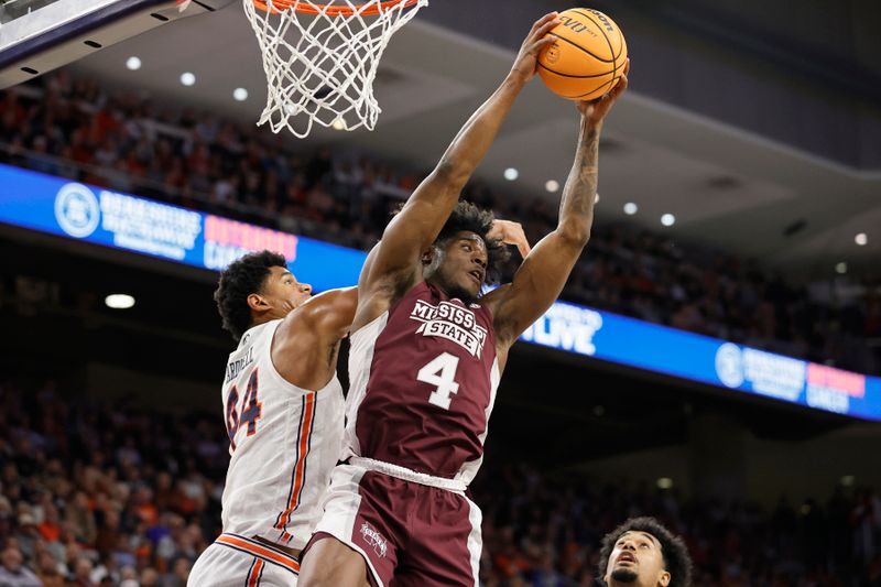 Jan 14, 2023; Auburn, Alabama, USA;  Mississippi State Bulldogs guard Cameron Matthews (4) grabs a rebound from Auburn Tigers center Dylan Cardwell (44) during the second half at Neville Arena. Mandatory Credit: John Reed-USA TODAY Sports