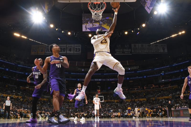 LOS ANGELES, CA - OCTOBER 26: LeBron James #23 of the Los Angeles Lakers drives to the basket during the game against the Sacramento Kings on October 26, 2024 at Crypto.Com Arena in Los Angeles, California. NOTE TO USER: User expressly acknowledges and agrees that, by downloading and/or using this Photograph, user is consenting to the terms and conditions of the Getty Images License Agreement. Mandatory Copyright Notice: Copyright 2024 NBAE (Photo by Adam Pantozzi/NBAE via Getty Images)