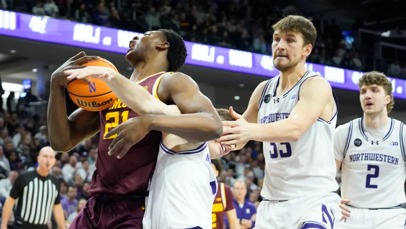 Mar 9, 2024; Evanston, Illinois, USA; Northwestern Wildcats guard Ryan Langborg (5) defends Minnesota Golden Gophers forward Pharrel Payne (21) during the first half at Welsh-Ryan Arena. Mandatory Credit: David Banks-USA TODAY Sports