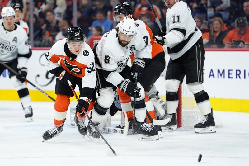 Jan 31, 2026; Philadelphia, Pennsylvania, USA; Los Angeles Kings defenseman Drew Doughty (8) and Philadelphia Flyers center Denver Barkley (52) battle for the puck in the second period at Xfinity Mobile Arena. Mandatory Credit: Kyle Ross-Imagn Images