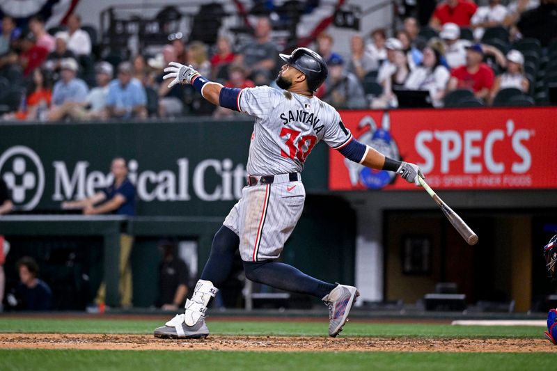 Aug 15, 2024; Arlington, Texas, USA; Minnesota Twins first baseman Carlos Santana (30) drives in the winning run against the Texas Rangers during the ninth inning at Globe Life Field. Mandatory Credit: Jerome Miron-USA TODAY Sports