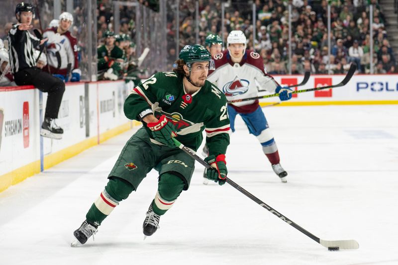 Apr 4, 2024; Saint Paul, Minnesota, USA; Minnesota Wild center Marat Khusnutdinov (22) carries the puck into the offensive zone against the Colorado Avalanche in the third period at Xcel Energy Center. Mandatory Credit: Matt Blewett-USA TODAY Sports