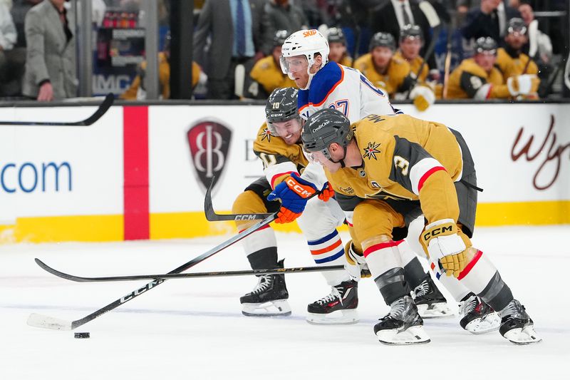 Mar 8, 2026; Las Vegas, Nevada, USA;Edmonton Oilers center Connor McDavid (97) skates between Vegas Golden Knights center Colton Sissons (10) and Vegas Golden Knights defenseman Brayden McNabb (3) during the second period  at T-Mobile Arena. Mandatory Credit: Stephen R. Sylvanie-Imagn Images
