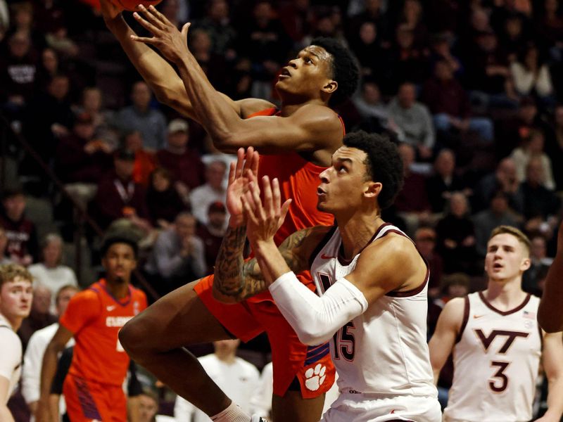 Jan 10, 2024; Blacksburg, Virginia, USA; Clemson Tigers forward RJ Godfrey (10) shoots the ball against Virginia Tech Hokies center Lynn Kidd (15) during the first half at Cassell Coliseum. Mandatory Credit: Peter Casey-USA TODAY Sports