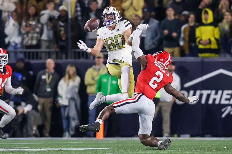 Nov 25, 2023; Atlanta, Georgia, USA; Georgia Tech Yellow Jackets tight end Brett Seither (80) reaches for a ball in front of Georgia Bulldogs linebacker Smael Mondon Jr. (2) in the second half at Bobby Dodd Stadium at Hyundai Field. Mandatory Credit: Brett Davis-USA TODAY Sports