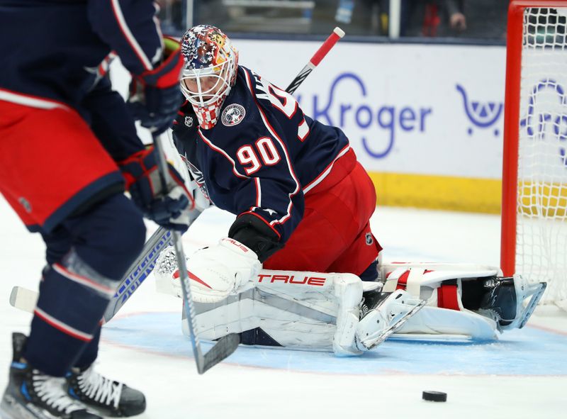 Oct 24, 2023; Columbus, Ohio, USA;  Columbus Blue Jackets goaltender Elvis Merzlikins (90) stops the puck during the first period against the Anaheim Ducks at Nationwide Arena. Mandatory Credit: Joseph Maiorana-USA TODAY Sports