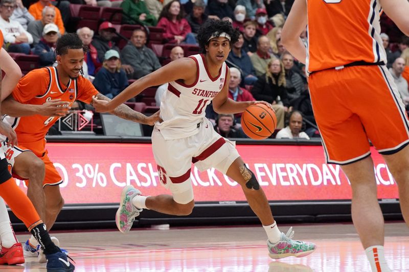 Jan 29, 2025; Stanford, California, USA;  Stanford Cardinal guard Ryan Agarwal (11) drives to the basket while being defended by Syracuse Orange forward Chris Bell (4) during the first half at Maples Pavilion. Mandatory Credit: David Gonzales-Imagn Images