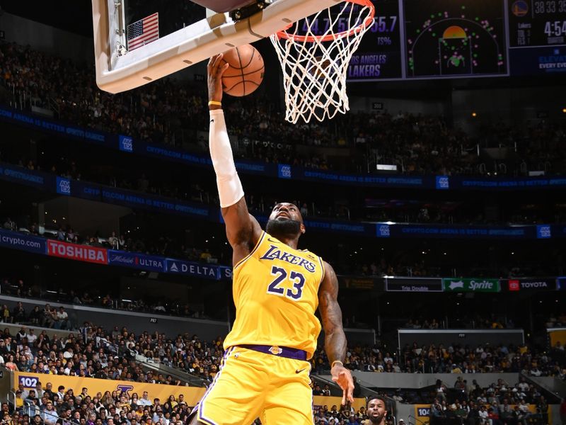 LOS ANGELES, CA - APRIL 9: LeBron James #23 of the Los Angeles Lakers drives to the basket during the game against the Golden State Warriors on April 9, 2024 at Crypto.Com Arena in Los Angeles, California. NOTE TO USER: User expressly acknowledges and agrees that, by downloading and/or using this Photograph, user is consenting to the terms and conditions of the Getty Images License Agreement. Mandatory Copyright Notice: Copyright 2024 NBAE (Photo by Andrew D. Bernstein/NBAE via Getty Images)