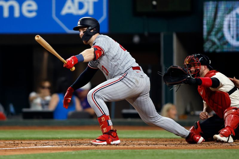 Sep 2, 2023; Arlington, Texas, USA; Minnesota Twins catcher Ryan Jeffers (27) singles in a run in the fourth inning against the Texas Rangers at Globe Life Field. Mandatory Credit: Tim Heitman-USA TODAY Sports