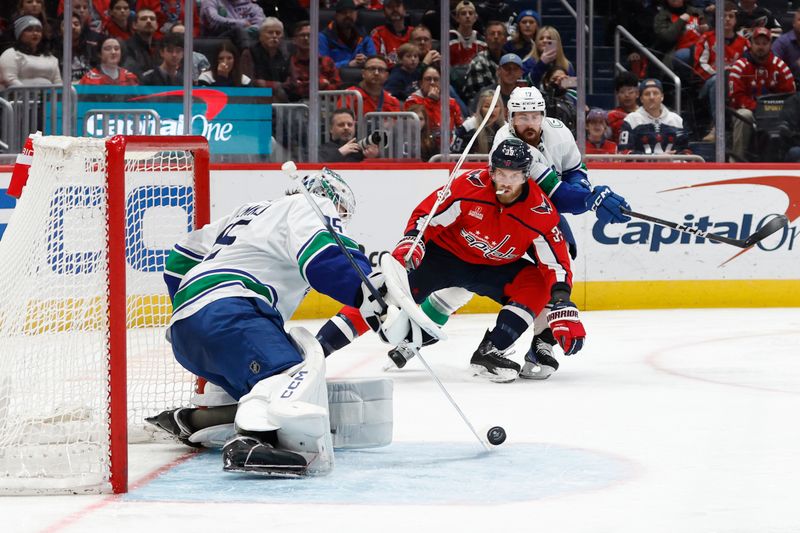 Feb 11, 2024; Washington, District of Columbia, USA; Vancouver Canucks goaltender Thatcher Demko (35) makes a save on Washington Capitals right wing Anthony Mantha (39) in the third period at Capital One Arena. Mandatory Credit: Geoff Burke-USA TODAY Sports