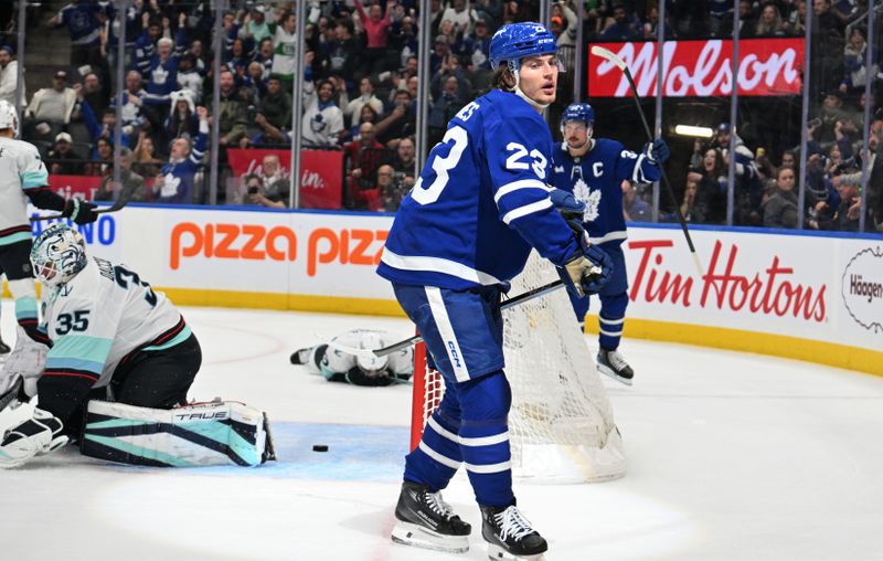 Oct 31, 2024; Toronto, Ontario, CAN;  Toronto Maple Leafs forward Matthew Knies (23) reacts after scoring a goal against the Seattle Kraken in the first period at Scotiabank Arena. Mandatory Credit: Dan Hamilton-Imagn Images