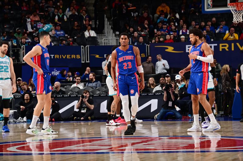 DETROIT, MI - MARCH 11: Simone Fontecchio #19, Jaden Ivey #23 and Cade Cunningham #2 of the Detroit Pistons looks on during the game against the Charlotte Hornets  on March 11, 2024 at Little Caesars Arena in Detroit, Michigan. NOTE TO USER: User expressly acknowledges and agrees that, by downloading and/or using this photograph, User is consenting to the terms and conditions of the Getty Images License Agreement. Mandatory Copyright Notice: Copyright 2024 NBAE (Photo by Chris Schwegler/NBAE via Getty Images)