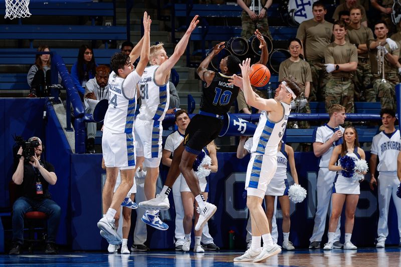 Mar 4, 2023; Colorado Springs, Colorado, USA; Air Force Falcons guard Camden Vander Zwaag (30) strips the ball from San Jose State Spartans guard Omari Moore (10) as forward Rytis Petraitis (31) and forward Beau Becker (14) defend in the second half at Clune Arena. Mandatory Credit: Isaiah J. Downing-USA TODAY Sports