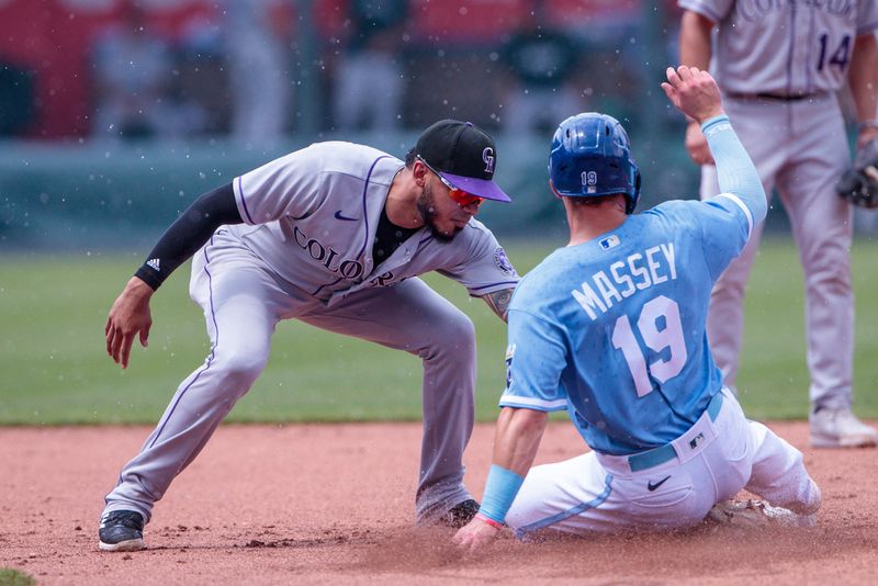 Jun 4, 2023; Kansas City, Missouri, USA; Colorado Rockies second baseman Harold Castro (30) tags Kansas City Royals second baseman Michael Massey (19) as he slides into second base during the fifth inning at Kauffman Stadium. Mandatory Credit: William Purnell-USA TODAY Sports