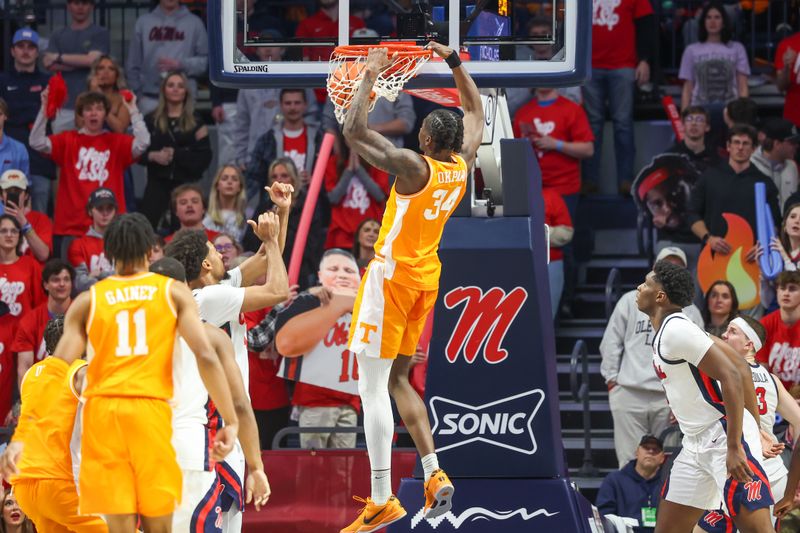 Mar 5, 2025; Oxford, Mississippi, USA; Tennessee Volunteers forward Felix Okra (34) dunks the ball against the Mississippi Rebels during the second half at The Sandy and John Black Pavilion at Ole Miss. Mandatory Credit: Wesley Hale-Imagn Images