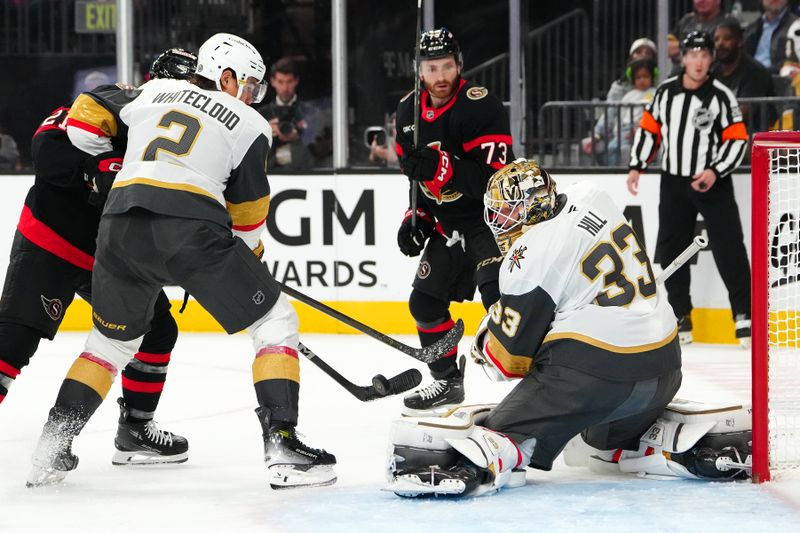 Oct 25, 2024; Las Vegas, Nevada, USA; Vegas Golden Knights goaltender Adin Hill (33) makes a save against the Ottawa Senators during the first period at T-Mobile Arena. Mandatory Credit: Stephen R. Sylvanie-Imagn Images