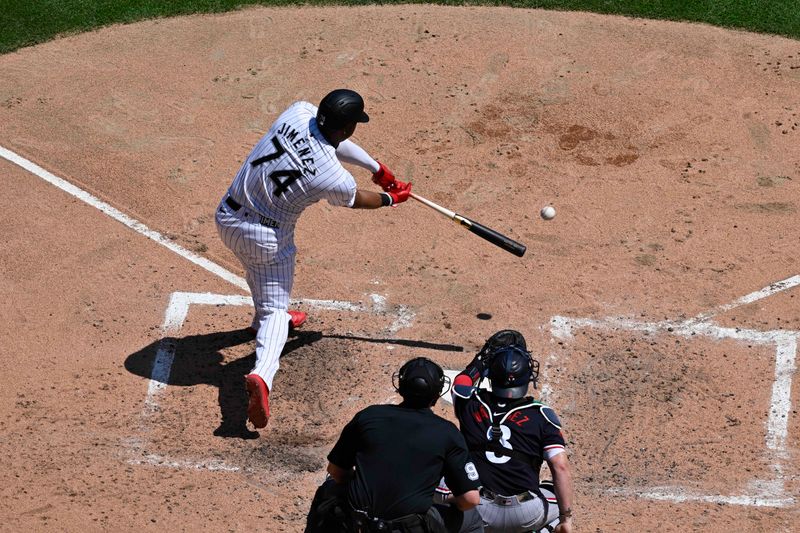 Jul 10, 2024; Chicago, Illinois, USA;  Chicago White Sox designated hitter Eloy Jiménez (74) singles against the Minnesota Twins during the fifth inning at Guaranteed Rate Field. Mandatory Credit: Matt Marton-USA TODAY Sports