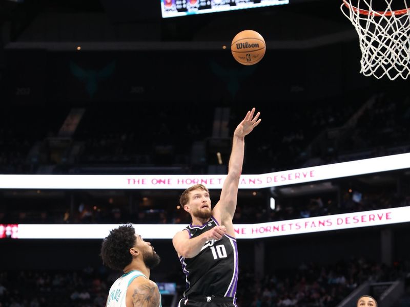 CHARLOTTE, NC - JANUARY 10: Domantas Sabonis #10 of the Sacramento Kings shoots the ball during the game against the Charlotte Hornets on January  10, 2024 at Spectrum Center in Charlotte, North Carolina. NOTE TO USER: User expressly acknowledges and agrees that, by downloading and or using this photograph, User is consenting to the terms and conditions of the Getty Images License Agreement.  Mandatory Copyright Notice:  Copyright 2024 NBAE (Photo by Brock Williams-Smith/NBAE via Getty Images) 