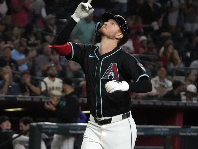 Jun 5, 2024; Phoenix, Arizona, USA; Arizona Diamondbacks outfielder Pavin Smith (26) hits a home run against the San Francisco Giants in the fifth inning at Chase Field. Mandatory Credit: Rick Scuteri-USA TODAY Sports