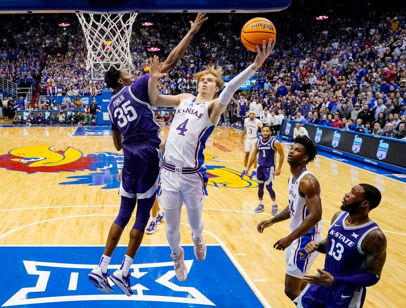 Jan 31, 2023; Lawrence, Kansas, USA; Kansas Jayhawks guard Gradey Dick (4) shoots against Kansas State Wildcats forward Nae'Qwan Tomlin (35) during the second half at Allen Fieldhouse. Mandatory Credit: Jay Biggerstaff-USA TODAY Sports