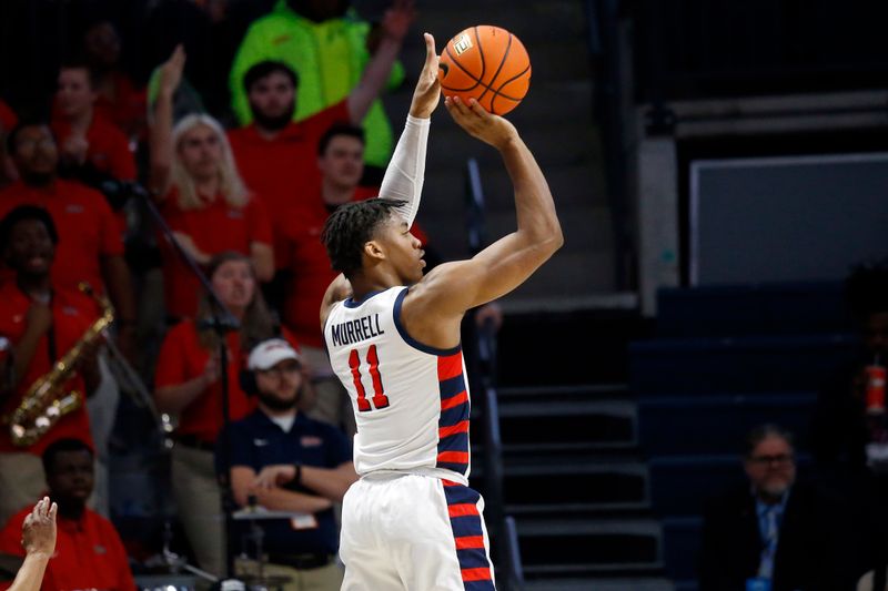 Feb 18, 2023; Oxford, Mississippi, USA; Mississippi Rebels guard Matthew Murrell (11) shoots for three during the first half against the Mississippi State Bulldogs at The Sandy and John Black Pavilion at Ole Miss. Mandatory Credit: Petre Thomas-USA TODAY Sports